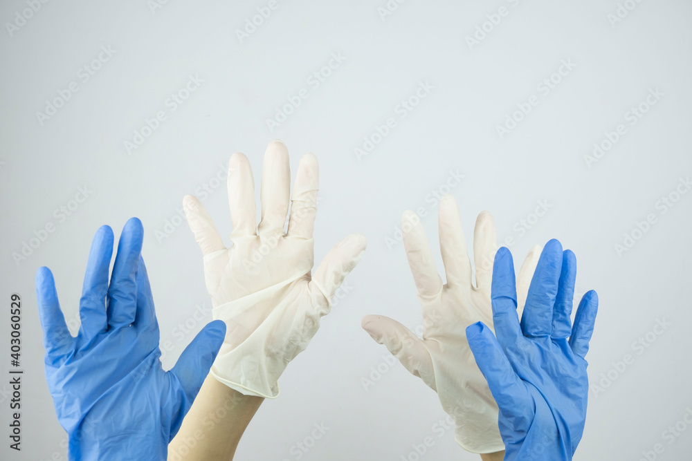 Obraz premium hands in rubber medical gloves raised up close up
