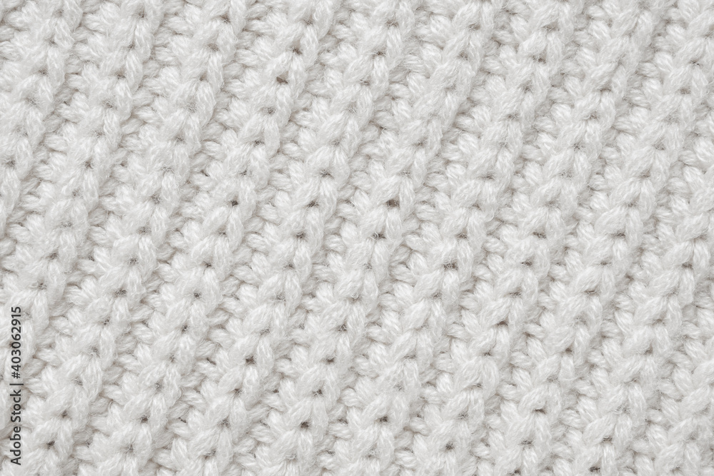 White knitted wool fabric texture background White knitted wool fabric texture background