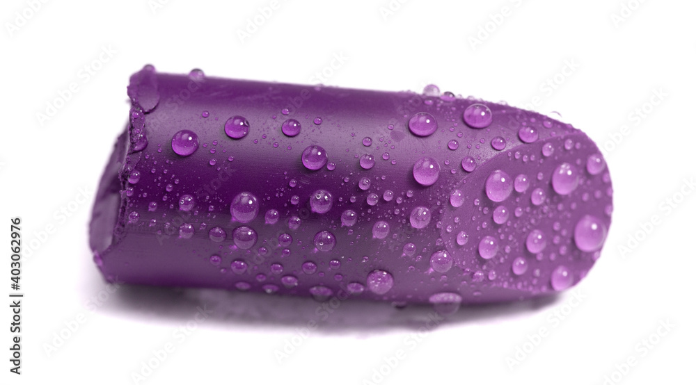 Single Tube of Lipstick Cut and Covered in Drops Water Isolated on a White Background Single Tube of Lipstick Cut and Covered in Drops Water Isolated on a White Background