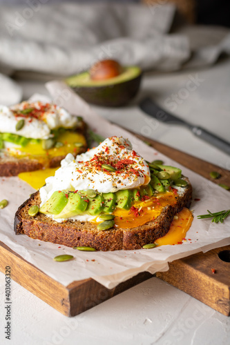 Two sandwiches with avocado and egg for breakfast