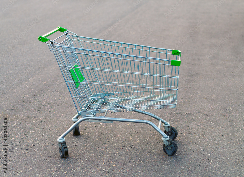 Empty shopping trolley side view Empty shopping trolley side view