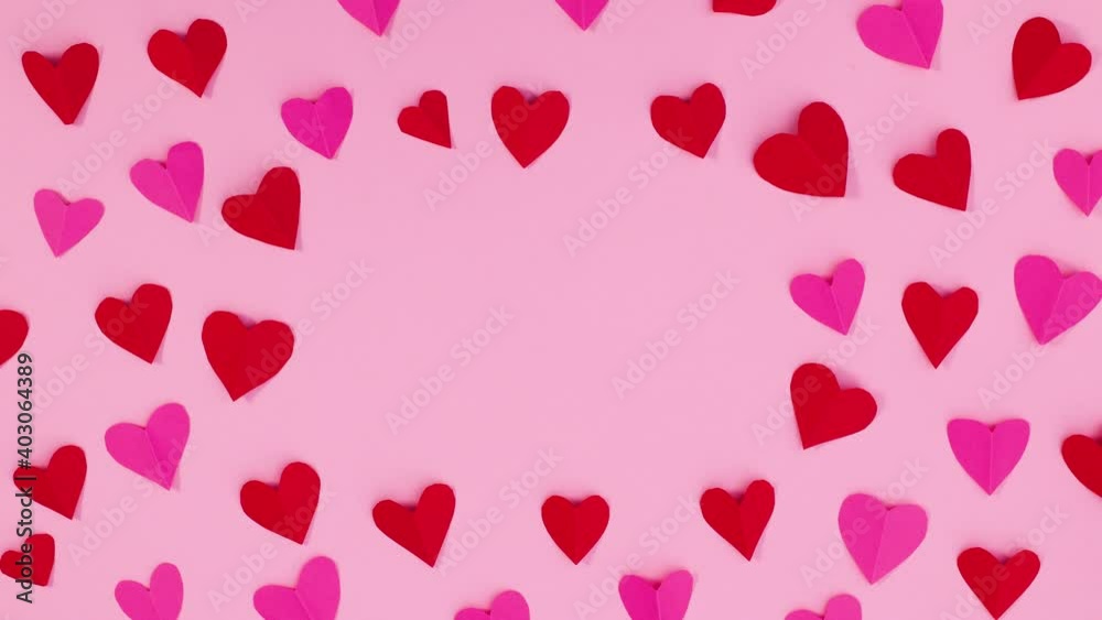 Red and pink valentine hearts move and leave empty space for text. Stop motion