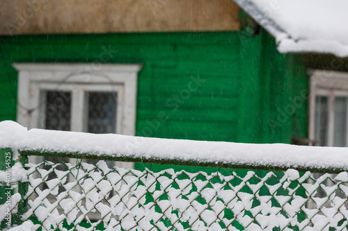 Fototapeta Naklejka Na Ścianę i Meble -  snowy winter on the streets of a small town in january 2021
