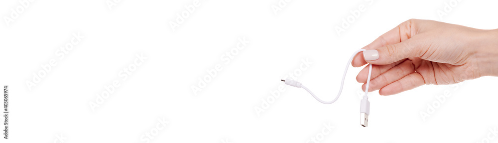 Hand with USB cable, connection wire. Isolated on white background. Hand with USB cable, connection wire. Isolated on white background.