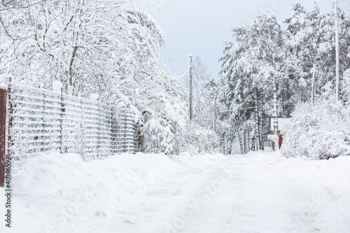 Fototapeta Naklejka Na Ścianę i Meble -  snowy winter on the streets of a small town in january 2021