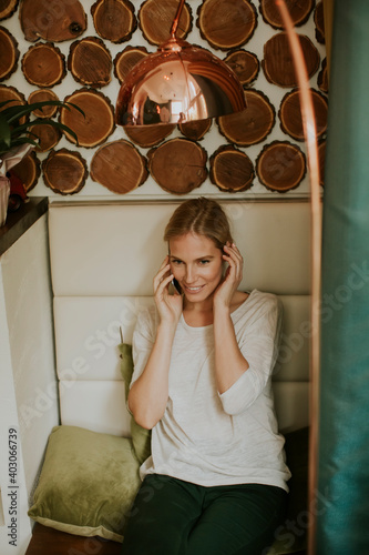 Pretty young woman sitting ...