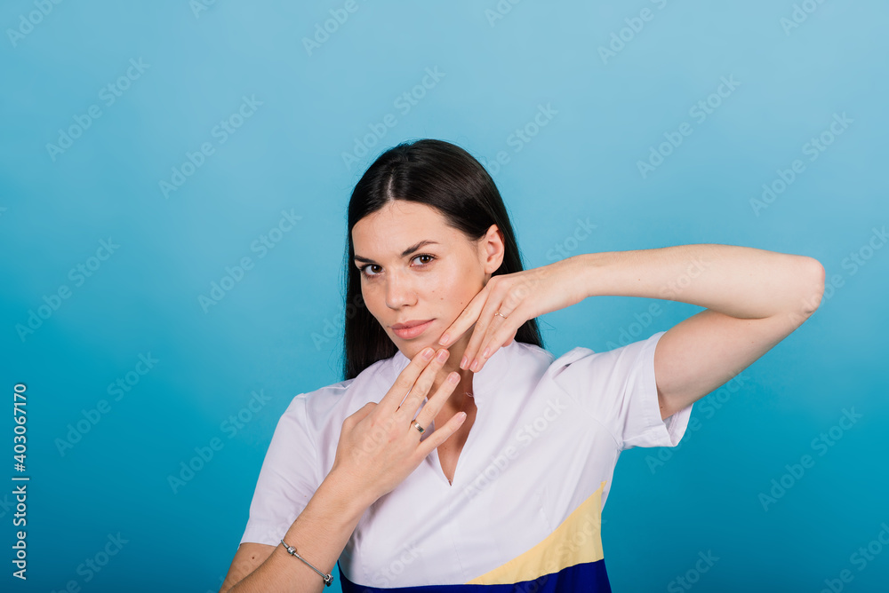 Portrait of a happy beautiful smiling woman touching her face isolated Portrait of a happy beautiful smiling woman touching her face isolated