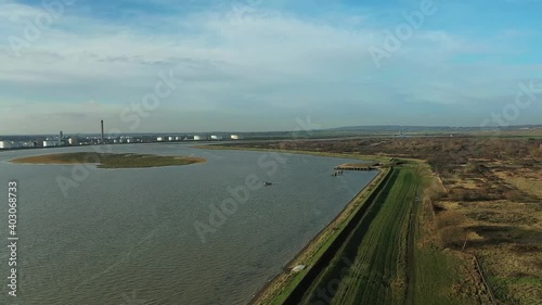 Wallpaper Mural Aerial : Descending drone shot above pier with industry and tankers in distance. Green rural to the right.  Mavic 2 Pro HD60fps Torontodigital.ca