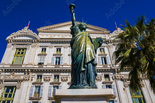 Small replica of the Statue of Liberty on Promenade des Anglais in front of Pera building in Nice, France