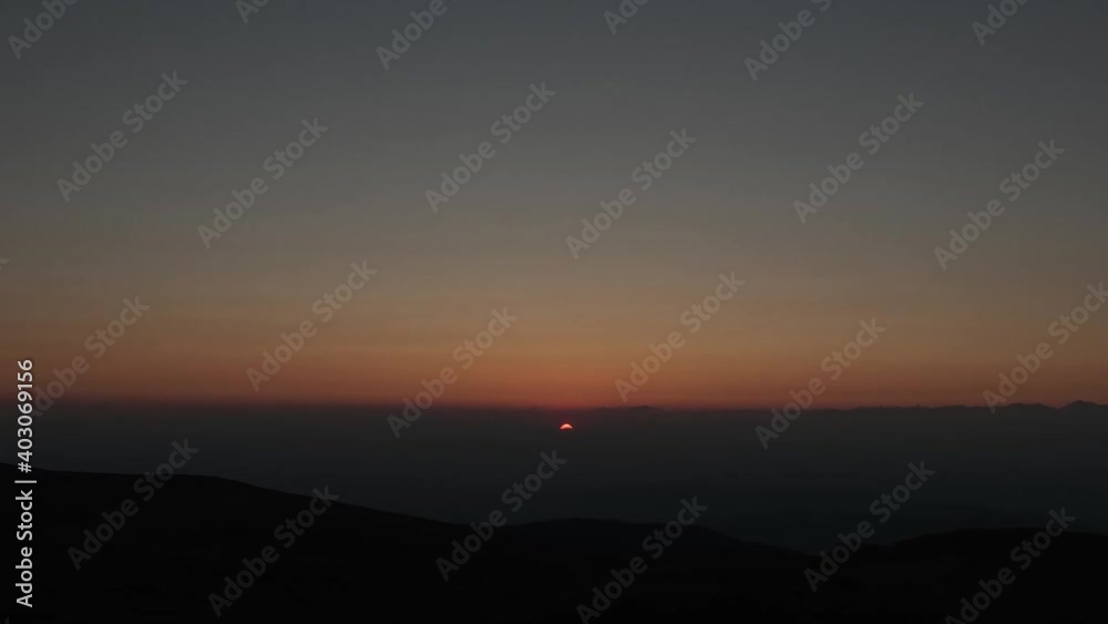 Time lapse of a sunset over the horizon in the mountains Time lapse of a sunset over the horizon in the mountains