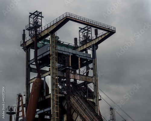 Blast Furnace in Dortmund, Germany. The coal mining and steel in the region collapsed and nowadays this colossal buildings are abandoned and unused. photo