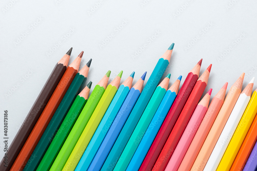 Fototapeta premium Colorful pencils in the case isolated on the gray background.