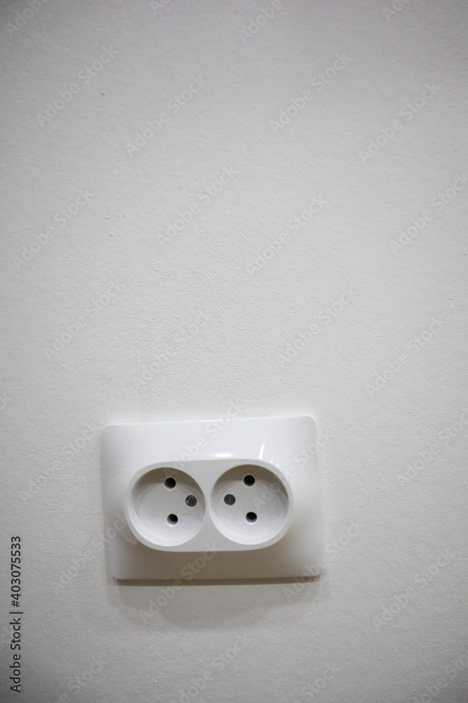 electrical outlet on white wall background electrical outlet on white wall background