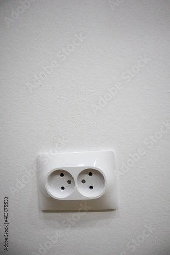 electrical outlet on white wall background