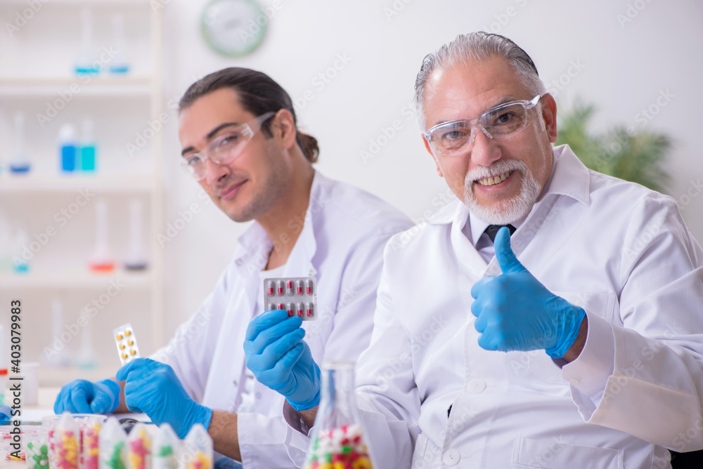 Two chemists working in the lab Two chemists working in the lab