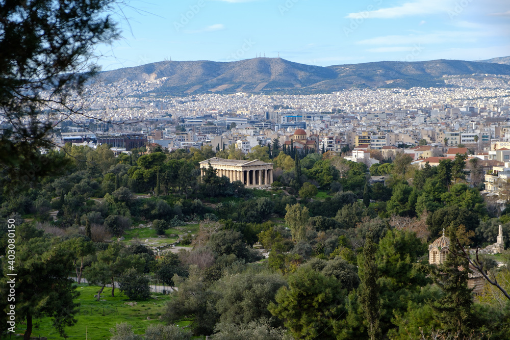 Athens - December 2019: view of Temple of Hephaestus with Athens in background