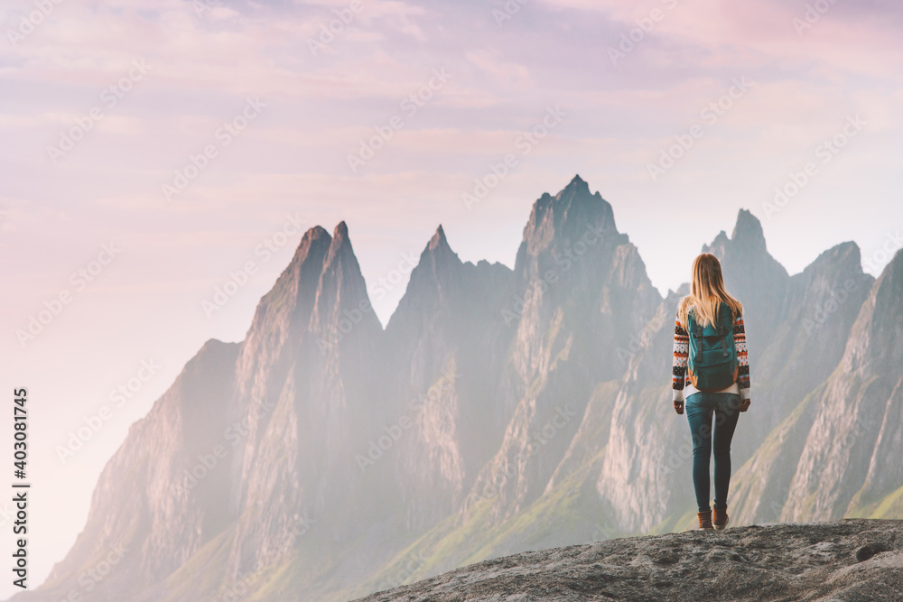 Fototapeta premium Traveler woman enjoying Okshornan peaks landscape in Norway travel lifestyle active vacation outdoor eco tourism Senja island