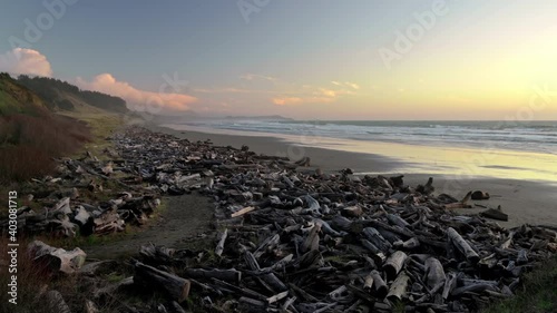 Driftwoods At The Pacific Ocean Coast On A Sunset. Panoramic View Of Cape Blanco State Park In Oregon - panning right photo