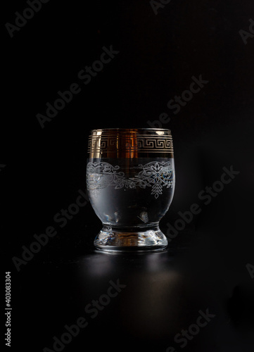 water in a beautiful glass on a black background