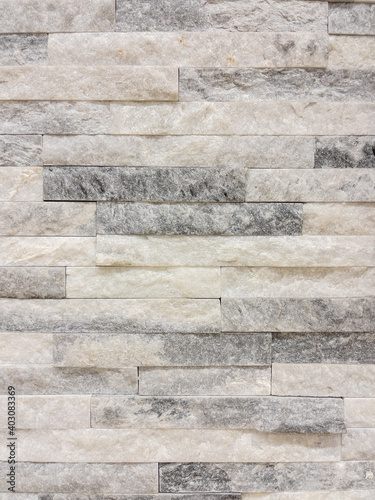 Texture - tiles for floor and wall imitating a wall of hewn uneven stone assembly