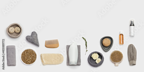 Spa still life background. Set for body care. Bottles with gel or shampoo, soap, wooden comb, washcloth for bath, sea salt.