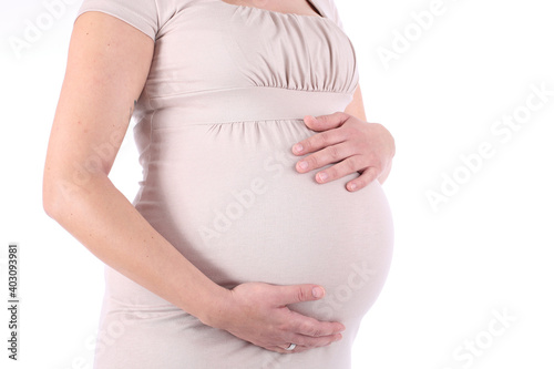 Close-up of pregnant woman touching her belly © Kay