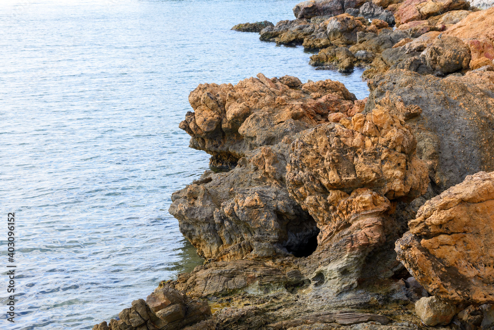 Beautiful sharp stones by the sea. Deserted rocky beach in the resort of Bodrum, Turkey. Beautiful sharp stones by the sea. Deserted rocky beach in the resort of Bodrum, Turkey.
