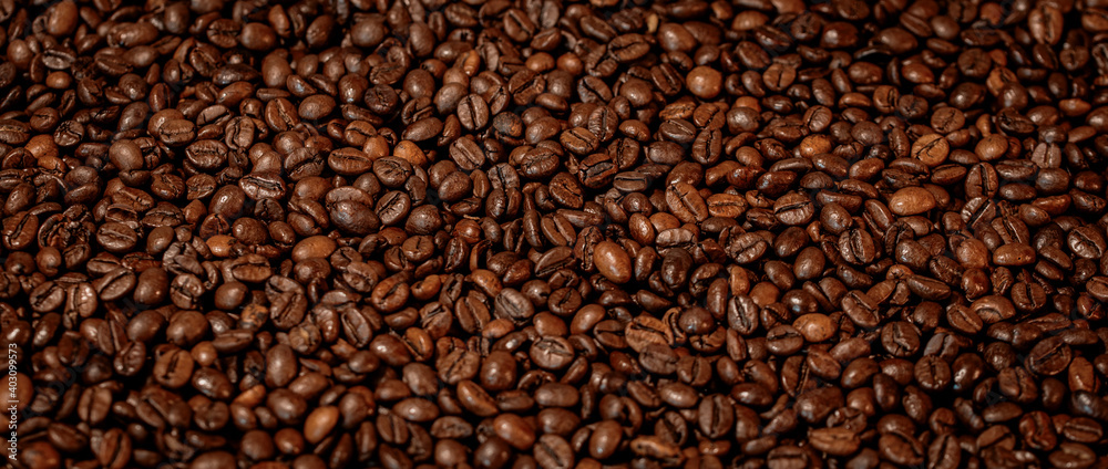 background of brown roasted coffee beans background of brown roasted coffee beans