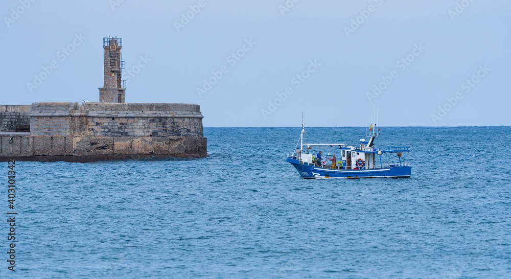 Fishing boat entering the port of Castro Urdiales, Cantabria, Spain, Europe
