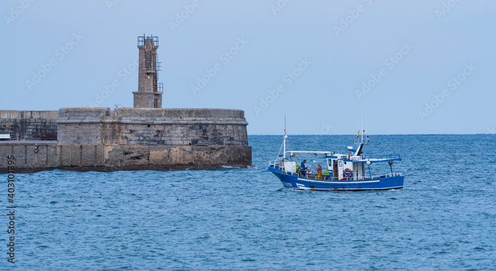 Fishing boat entering the port of Castro Urdiales, Cantabria, Spain, Europe