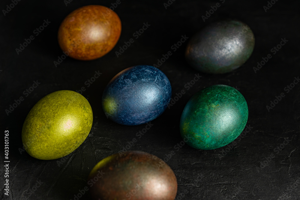 colorfull marble painted easter eggs on black background. Concept of minimal festive Easter backdrop colorfull marble painted easter eggs on black background. Concept of minimal festive Easter backdrop