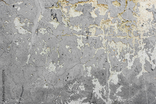 Texture of a concrete wall with cracks and scratches which can be used as a background