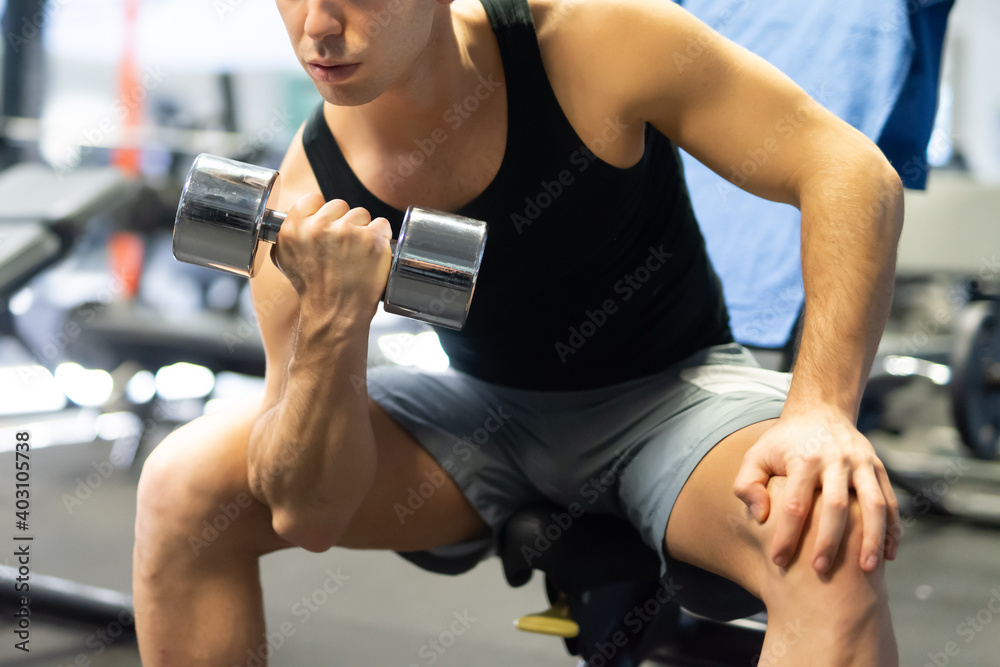 Bodybuilder working out in gym Bodybuilder working out in gym