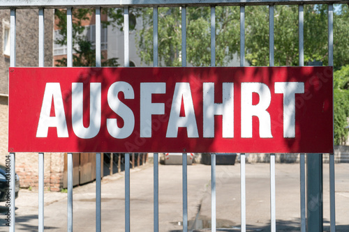 Red Ausfahrt plate, German for Exit, on a gate