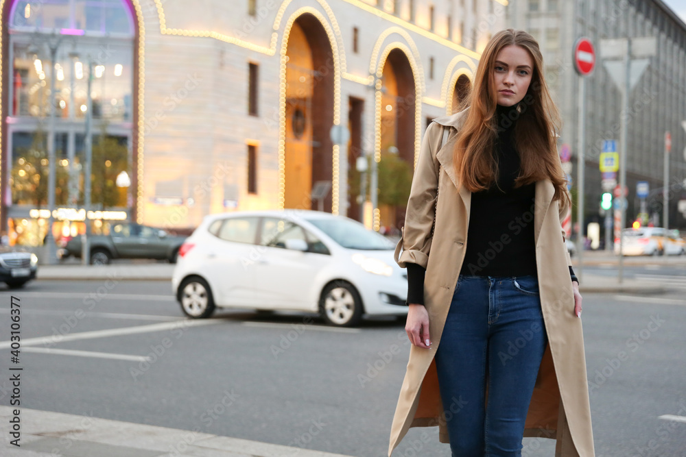 European woman walks in the city in spring European woman walks in the city in spring