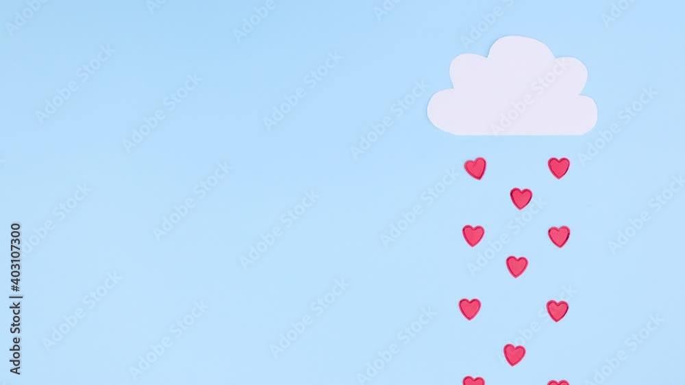 Raining hearts from white cloud on blue theme. Valentine's day stop motion Raining hearts from white cloud on blue theme. Valentine's day stop motion
