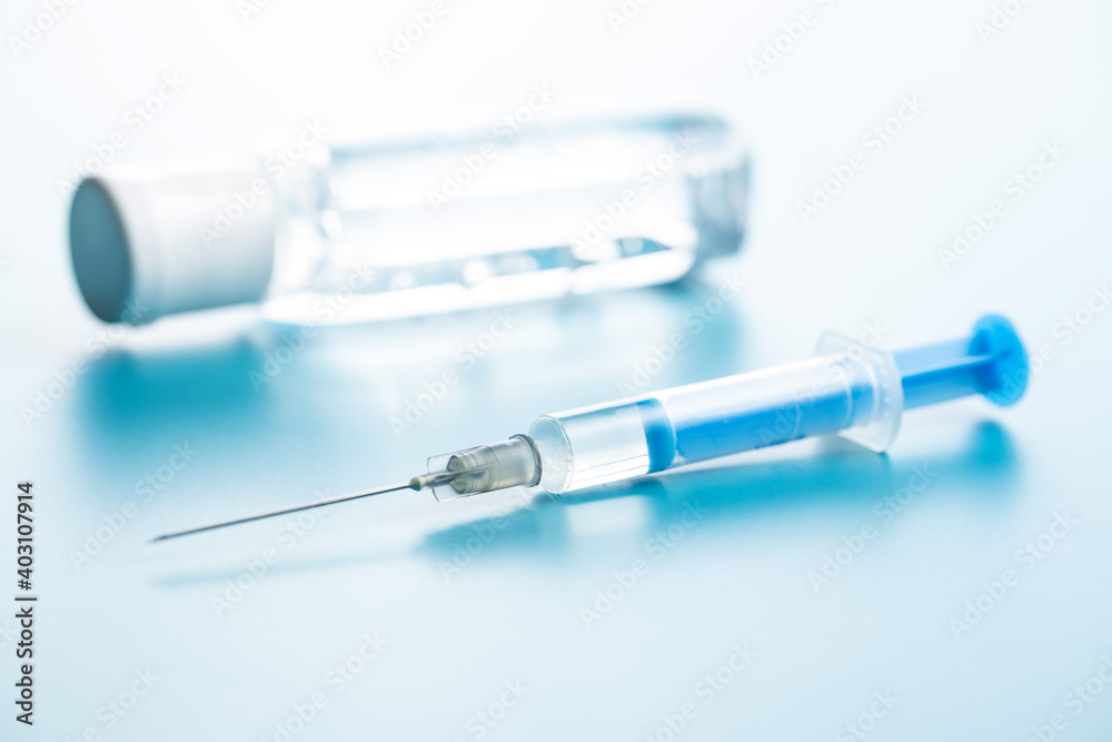 Injection syringe and sanitizer gel. Covid-19 coronavirus vaccination. Corona virus vaccine Injection syringe and sanitizer gel. Covid-19 coronavirus vaccination. Corona virus vaccine