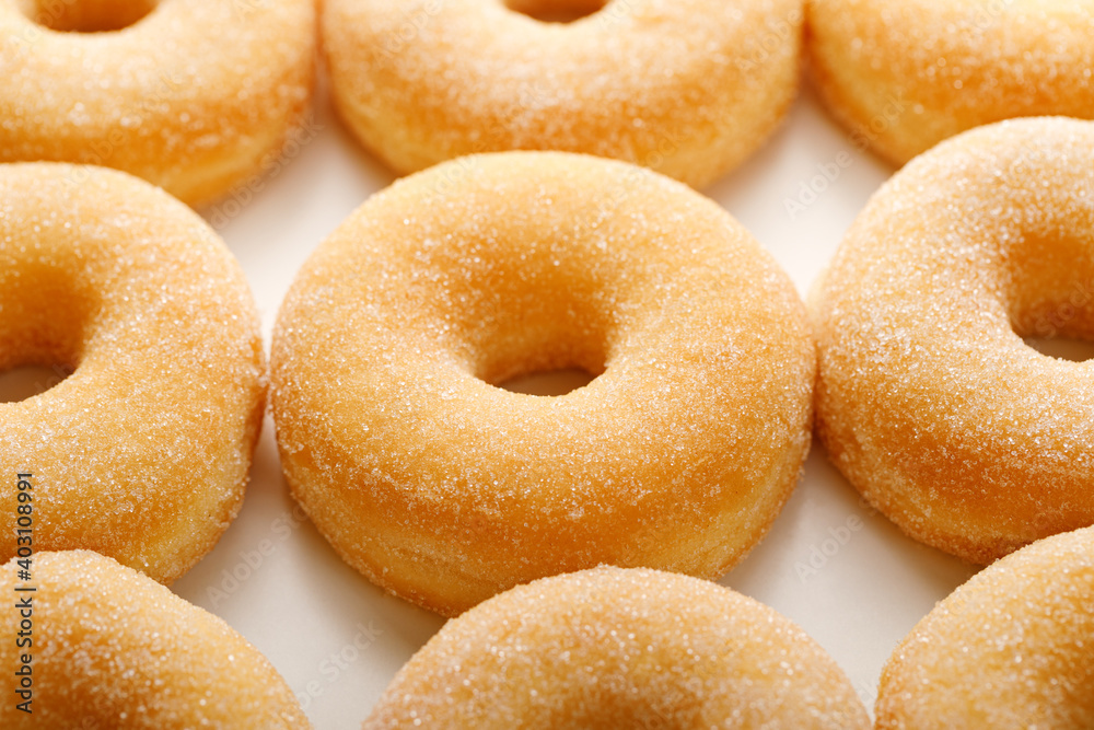 Sugar donuts on a white background, close up view