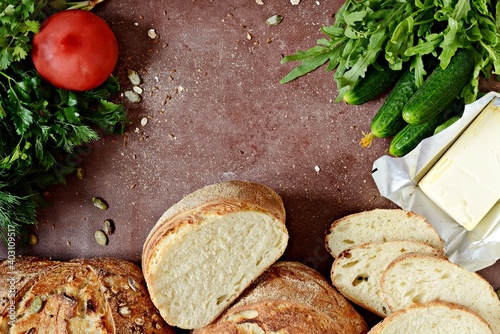 Wallpaper Mural Fresh bread for lunch from whole wheat with butter, fresh herbs and vegetables. Crisp French Unleavened bread. Torontodigital.ca