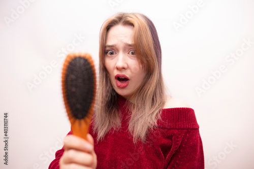 Girl combing hair isolated on white background