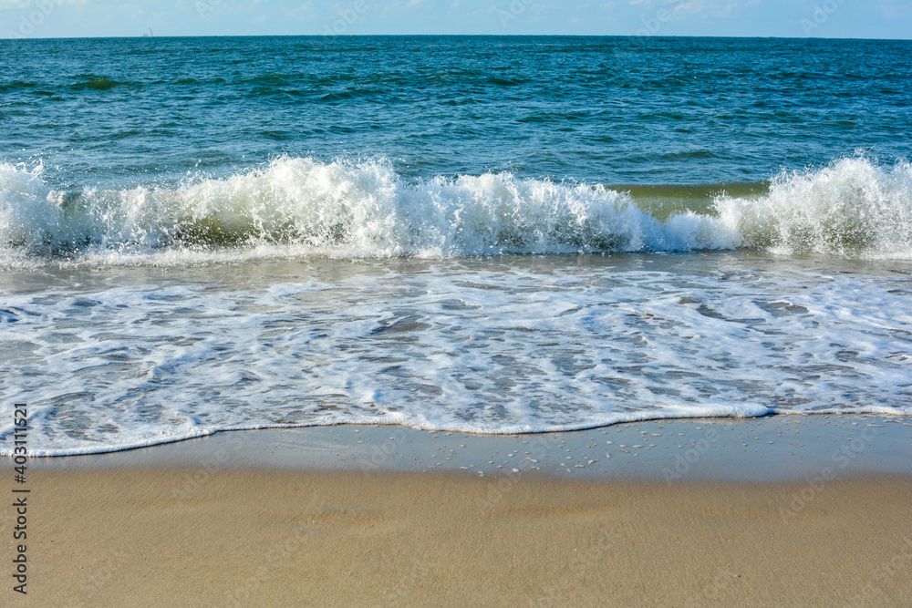 Fototapeta premium Waves on sand beach