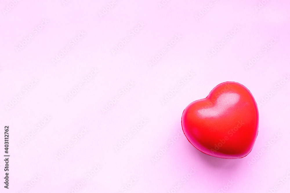 Fototapeta premium Valentines day red heart on pink paper background. Holidays card with copy space.