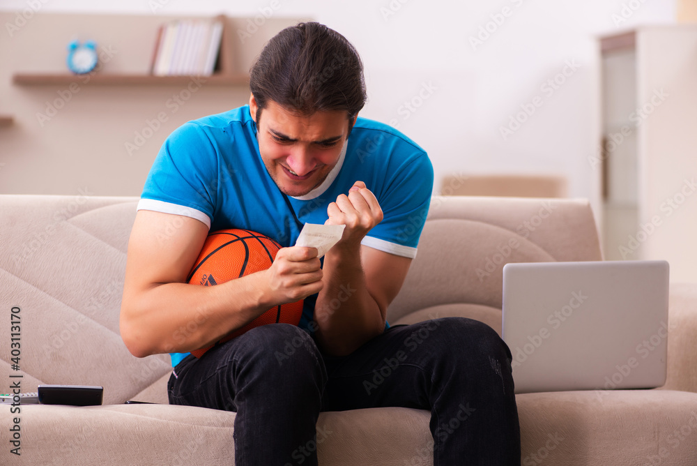 Sport bet addicted young man betting at home