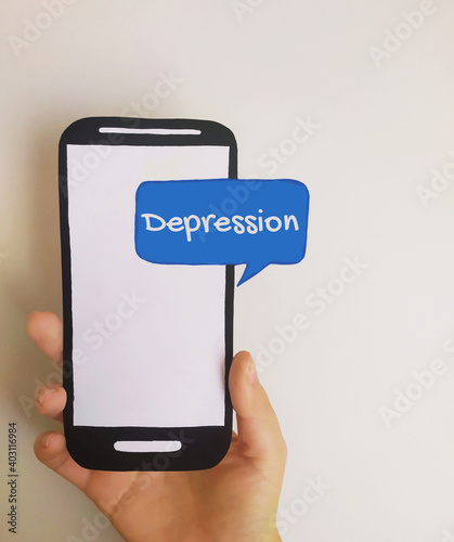 Receiving text message about depression on mobile phone photo
