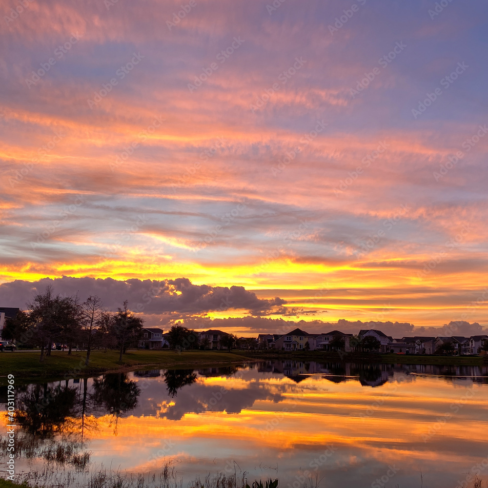 Beautiful pink, orange and blue sunset reflecting on a lake.