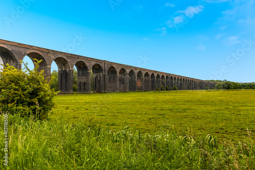 A view across the fields at Harringworth of the railway viaduct, the longest masonry viaduct in the UK