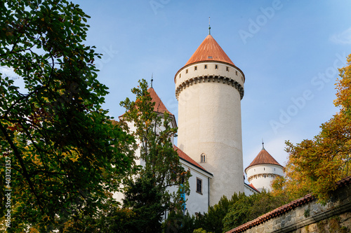 Historic Medieval Konopiste castle residence of Habsburg imperial family, white tower and park of romantic gothic baroque Chateau in autumn sunny day, Central Bohemia, Czech Republic