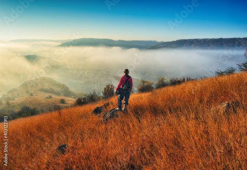 Young woman enjoying the beauty of nature in a picturesque canyon