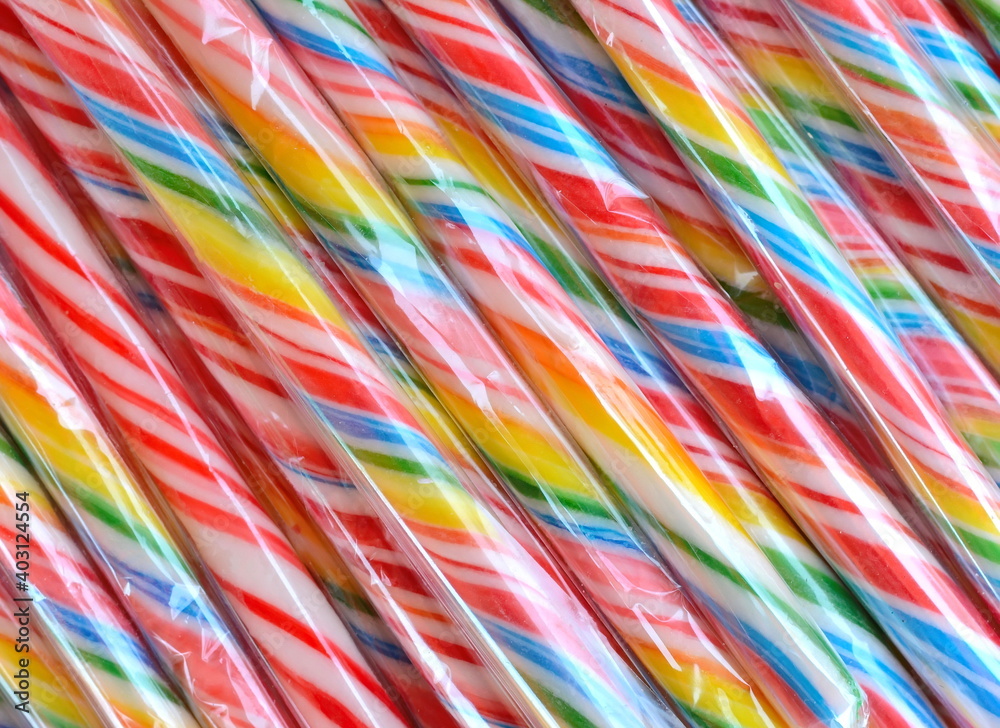 Lollipop background. Colorful lolly pops wrapped in cellophane.