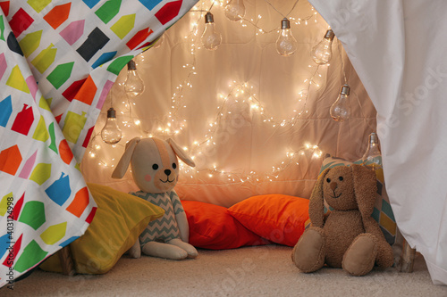 Fototapeta Play tent with toys and pillows indoors, closeup